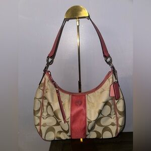 Coach women’s brown and pink signature stripe hobo shoulder bag